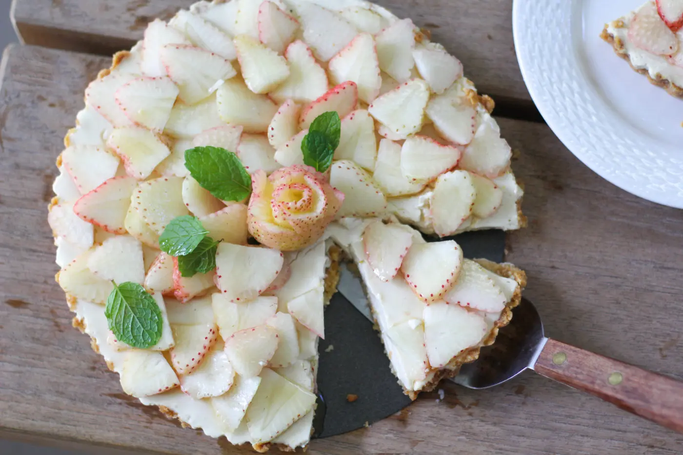 Pineberries used as a topping on a dessert